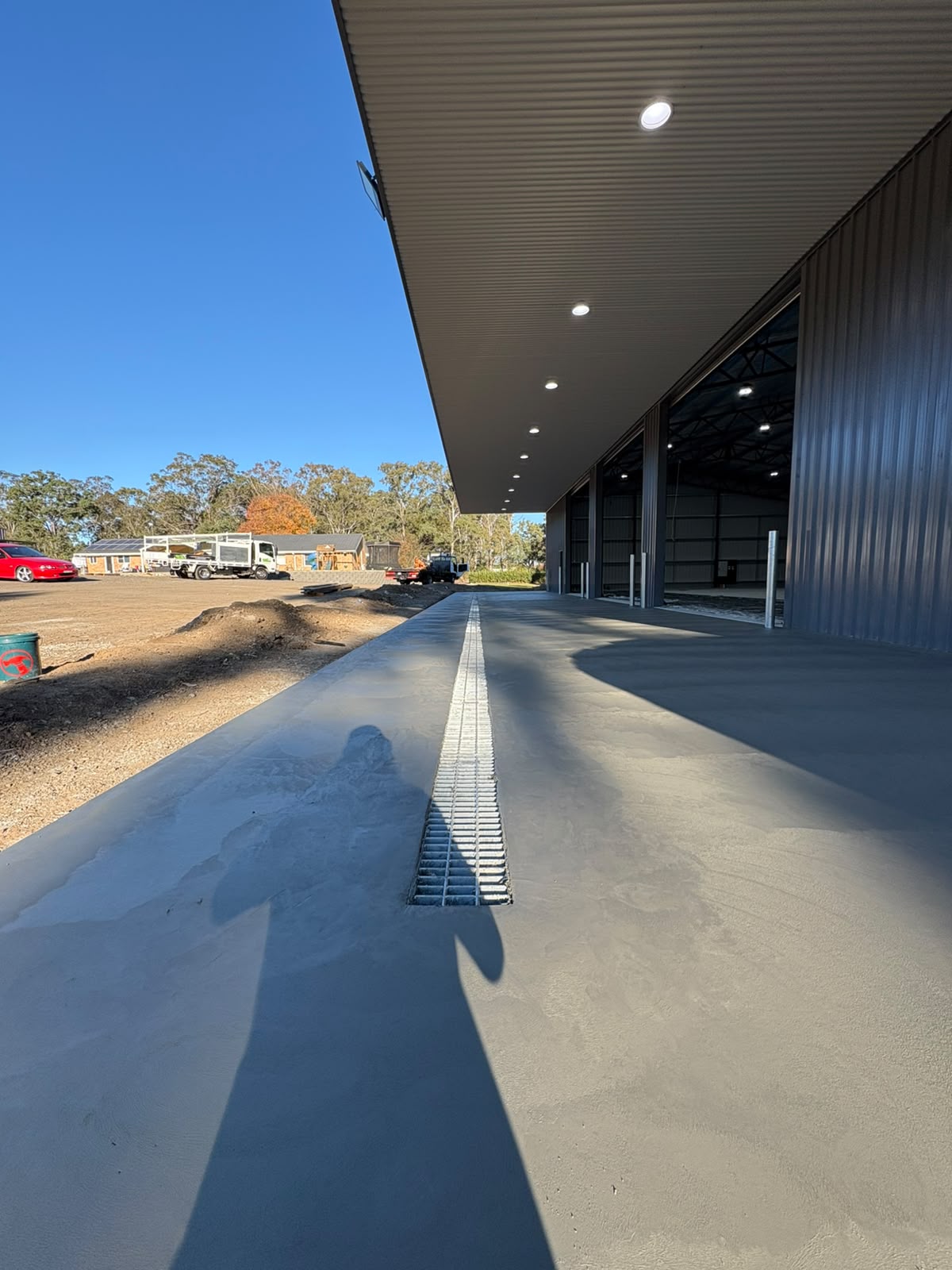 Concrete apron with a strip drain on a commercial site
