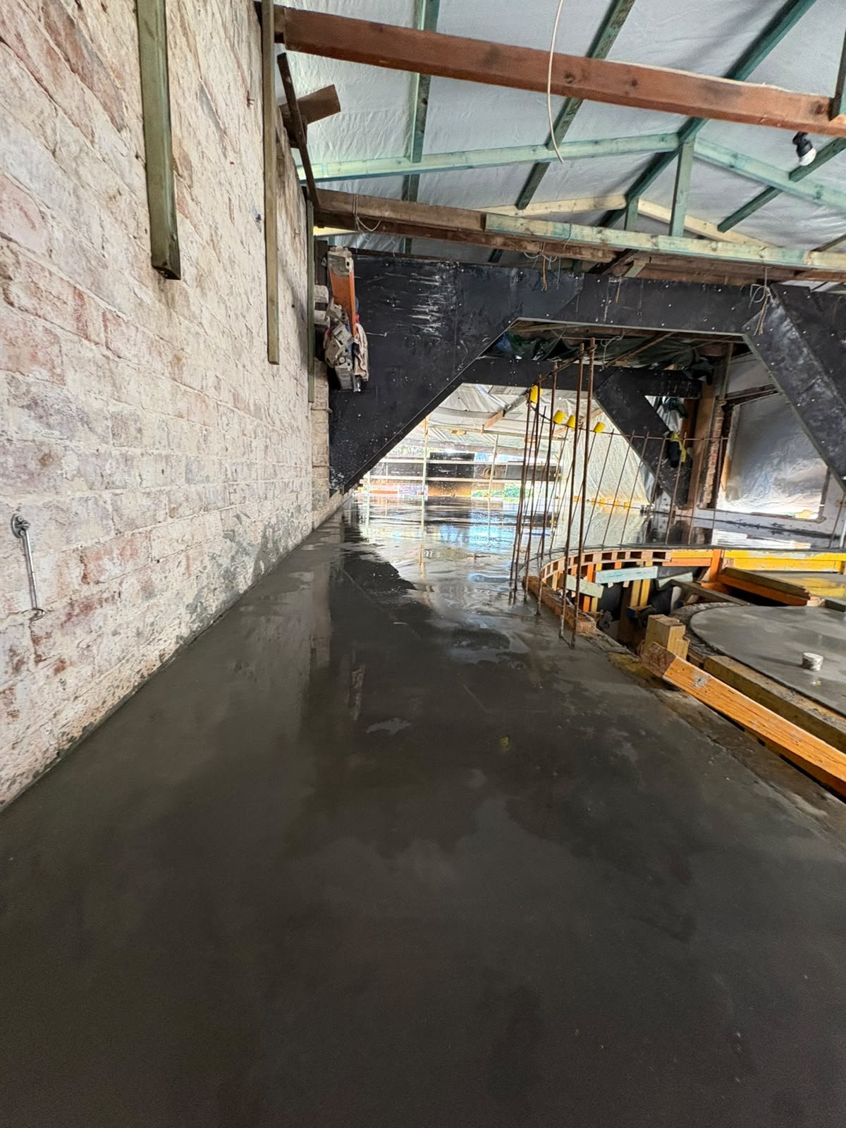 Internal concrete slab being poured inside a building